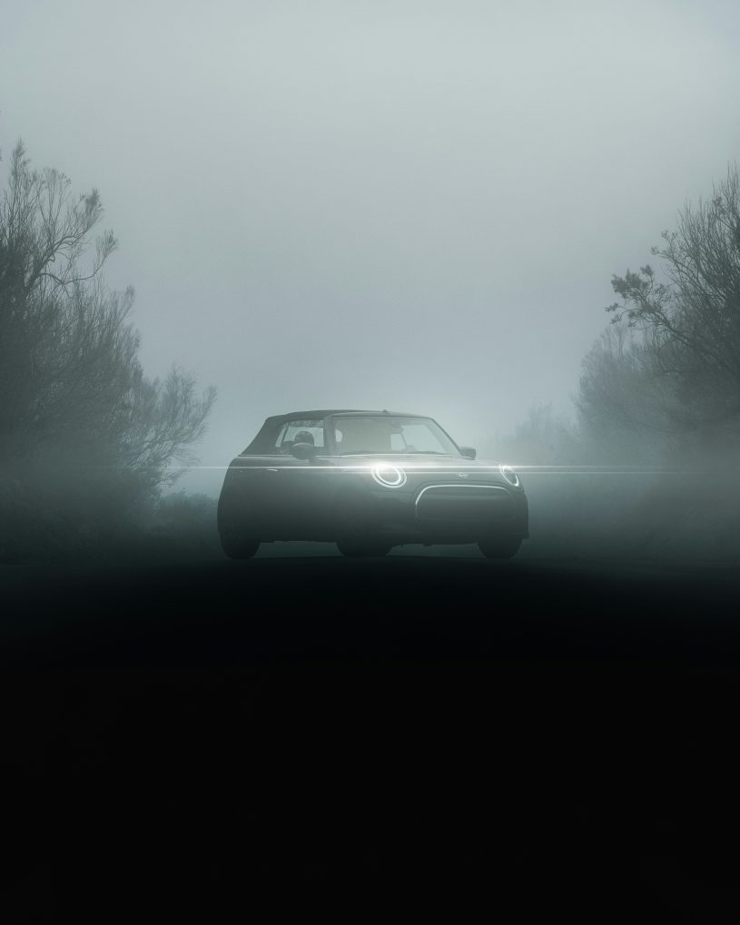 A car driving on a foggy road